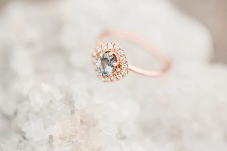 an uncooked rose ring sitting on top of white crystals