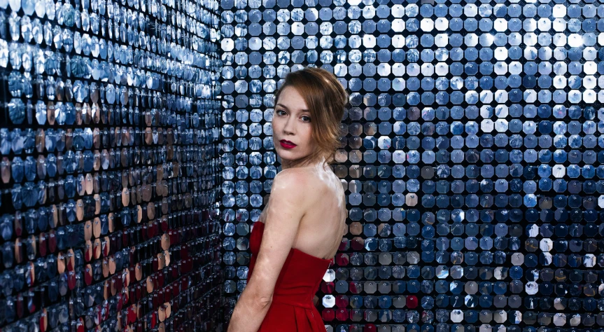 a woman in a red dress posing for a pograph