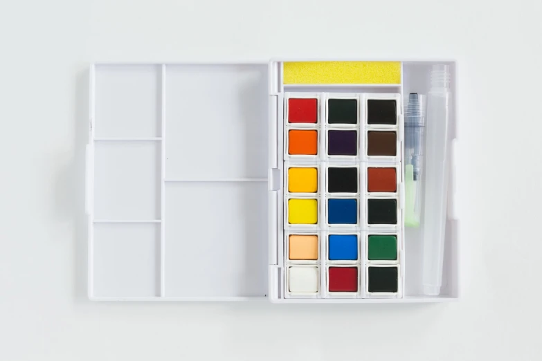 a watercolor palette is sitting on the table