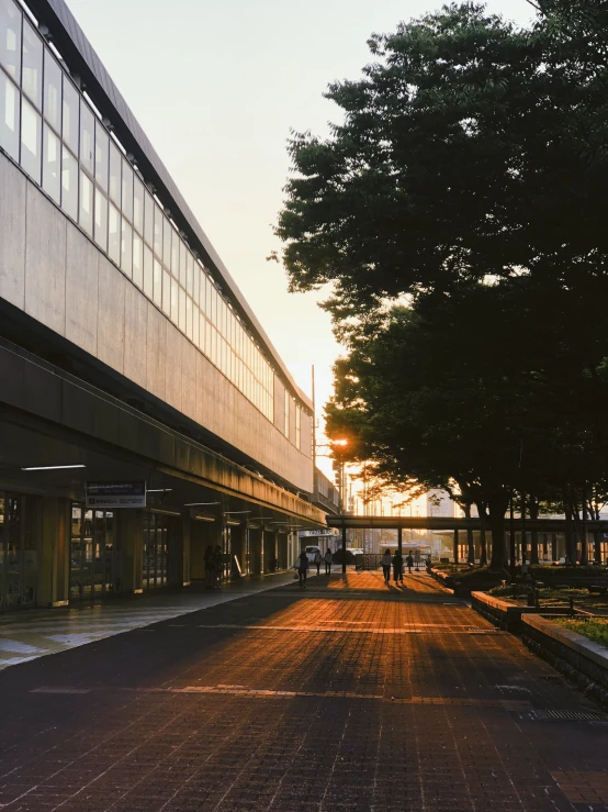 a person walking down an empty street in the evening