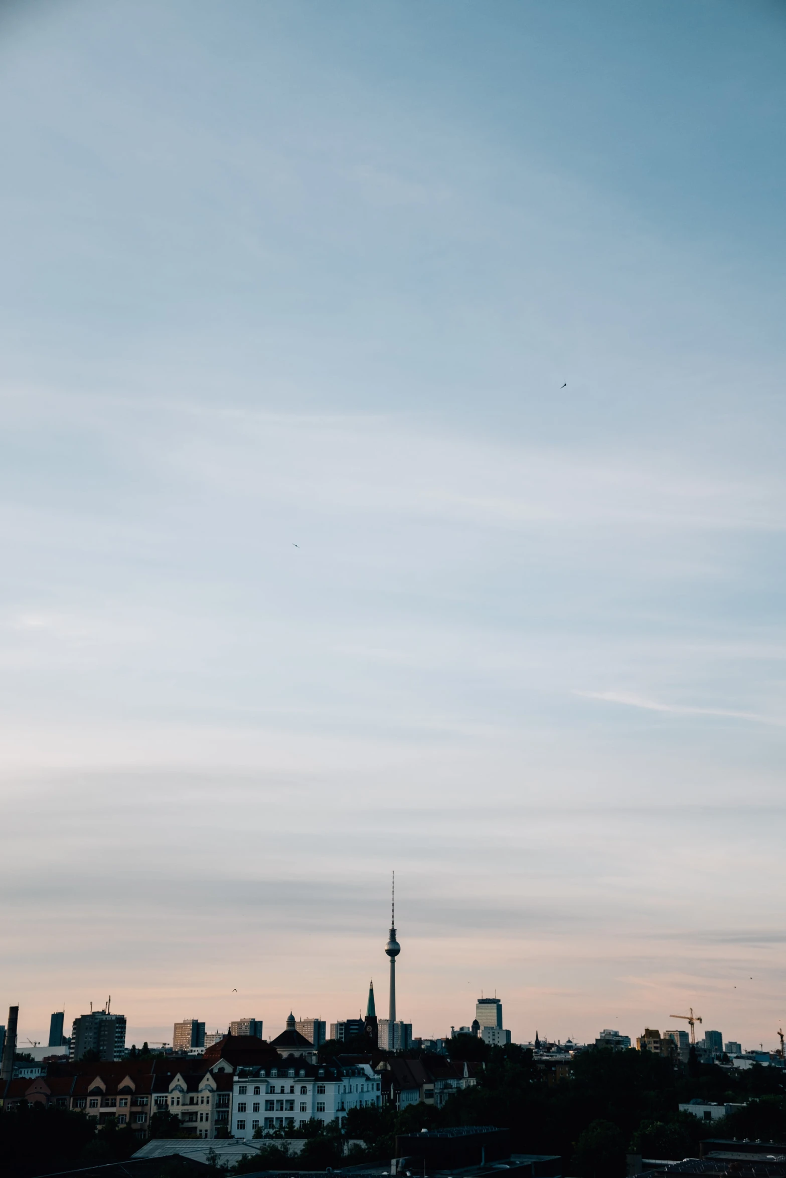 the view of an apartment building at dusk