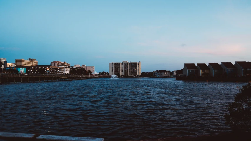 a large body of water with buildings on the side