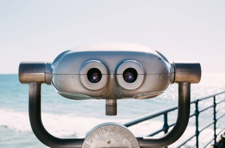 the binoculars have eyes that look as if they are being watched