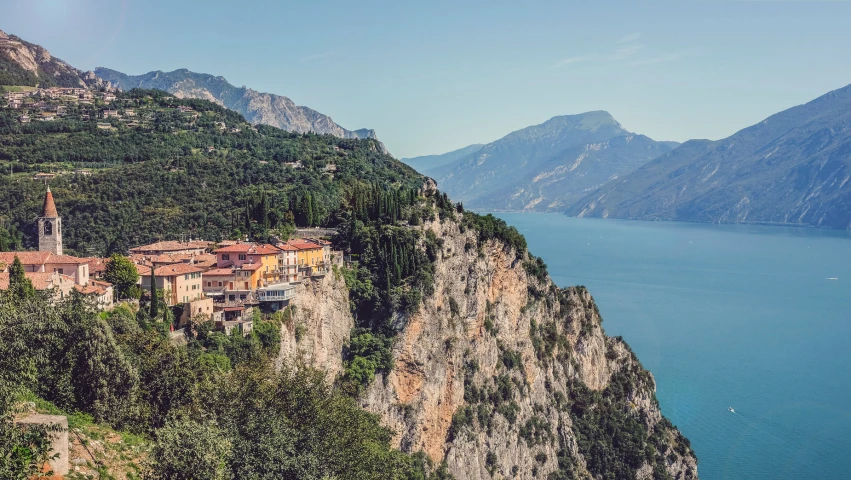 a small village built on a cliff overlooking the water