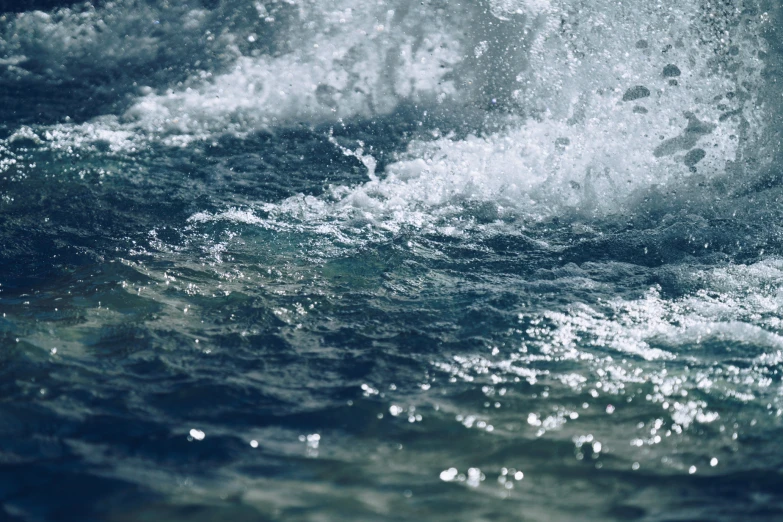 an ocean view of an extremely fast moving wave