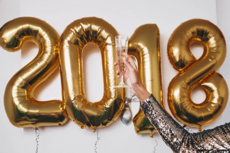 the woman is placing her hand on a glass with the number 2009 on it