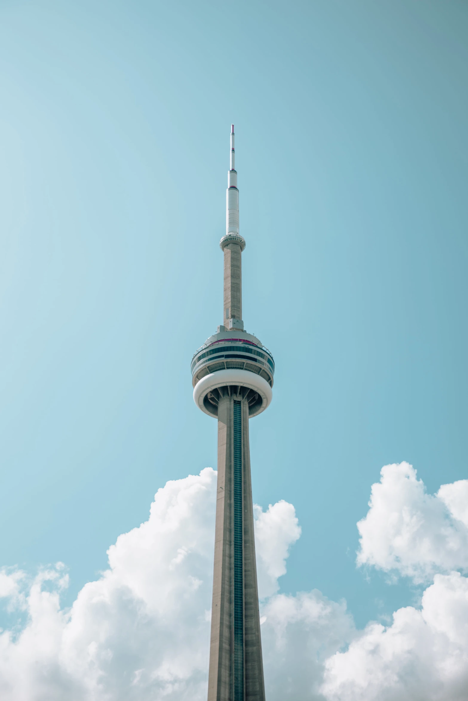 the tower that stands in the middle of a large area of sky