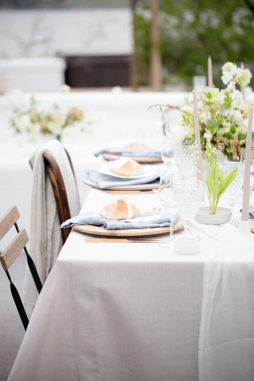 several plates on a table with napkins and silverware