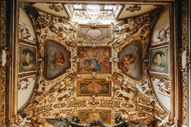 a room filled with beautifully decorated ceilings and paintings