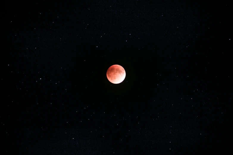 a  moon in the sky during a partial eclipse