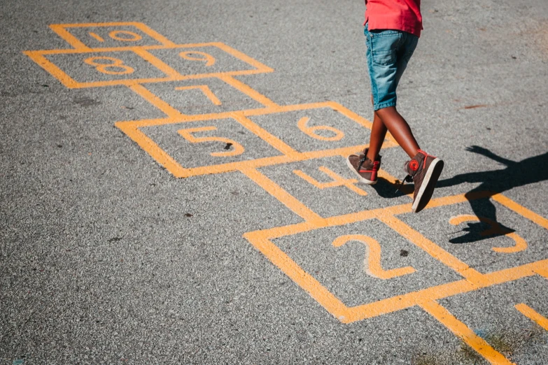 a person crossing the street on a skateboard