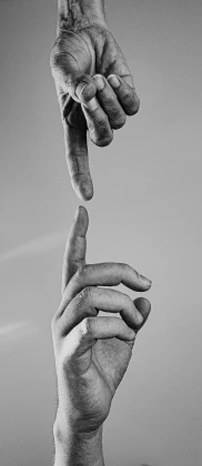 one finger is reaching up toward another hand