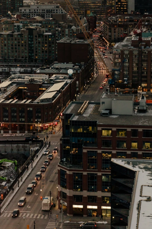 the city's skyline is covered in snow at dusk