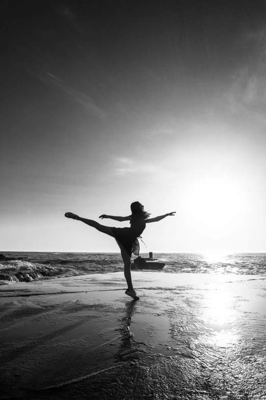 a woman standing in the ocean near the ocean