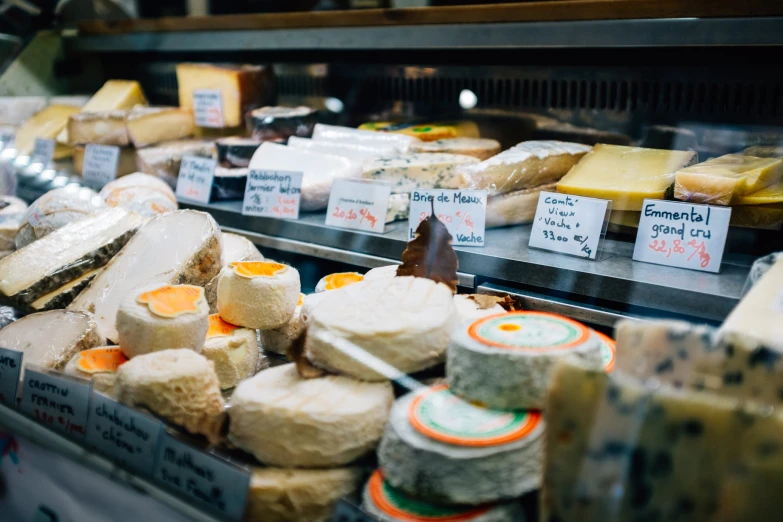 a variety of cheeses and ers are being displayed