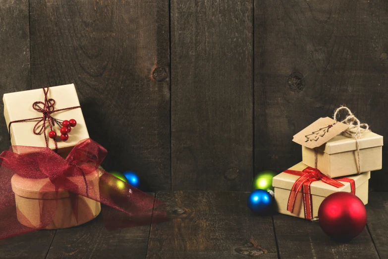 presents wrapped in cardboard sitting on a wooden table