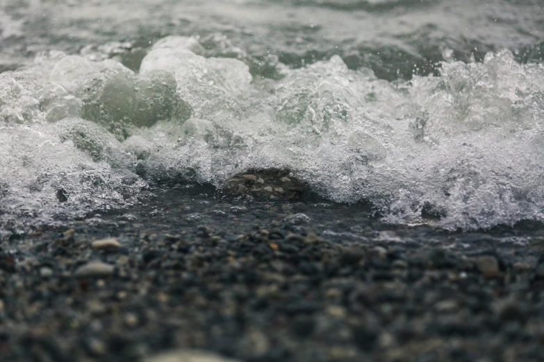 the water has choppy waves over stones