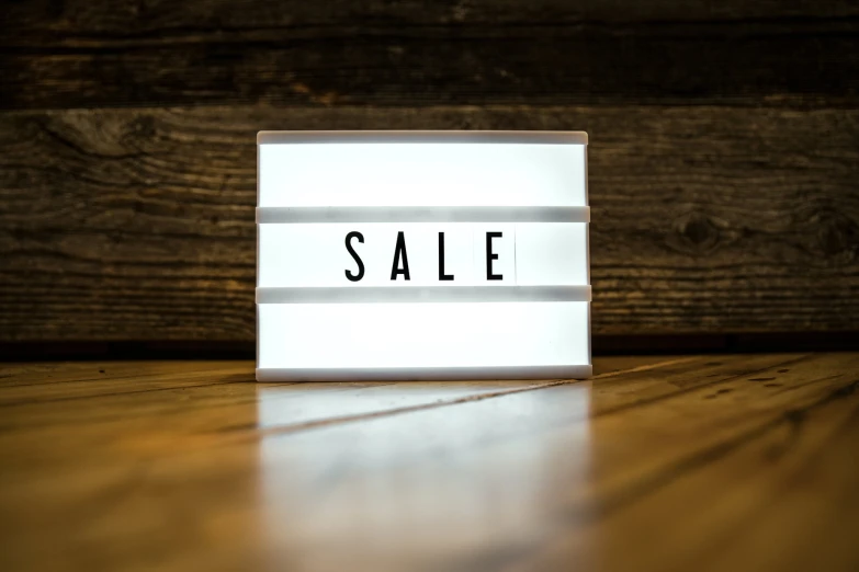 a small square light with a sale text on it