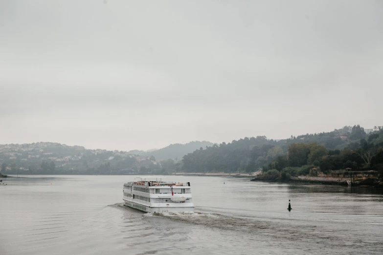 boat in middle of the water on cloudy day