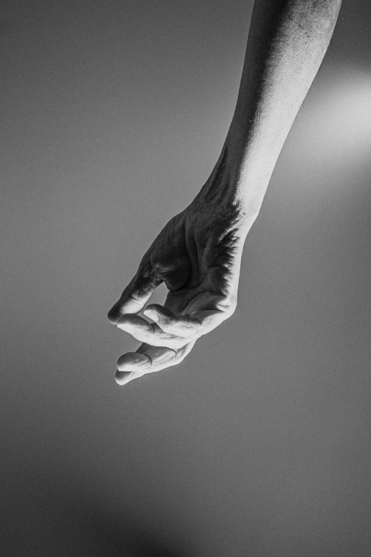 a black and white po of a hand reaching out