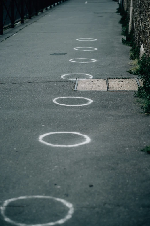 some circles painted on the pavement and a building