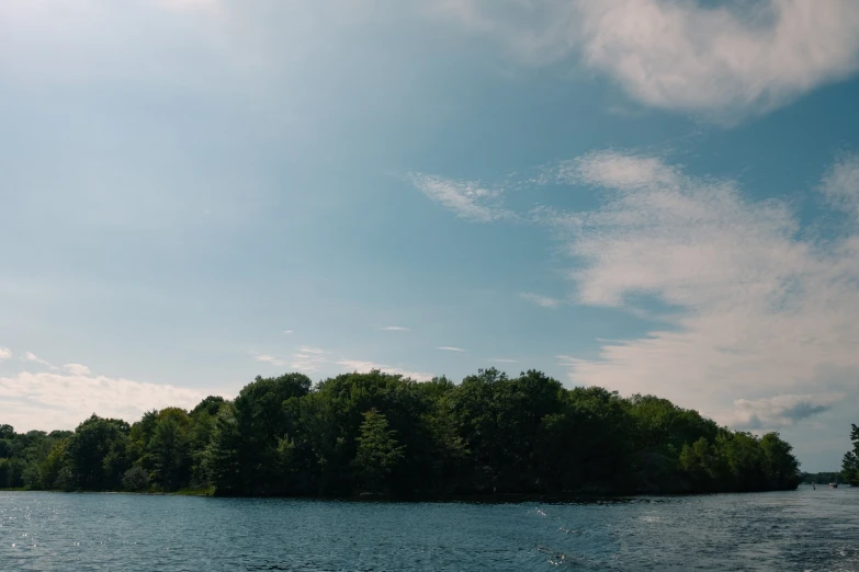 a boat is docked in the water near trees