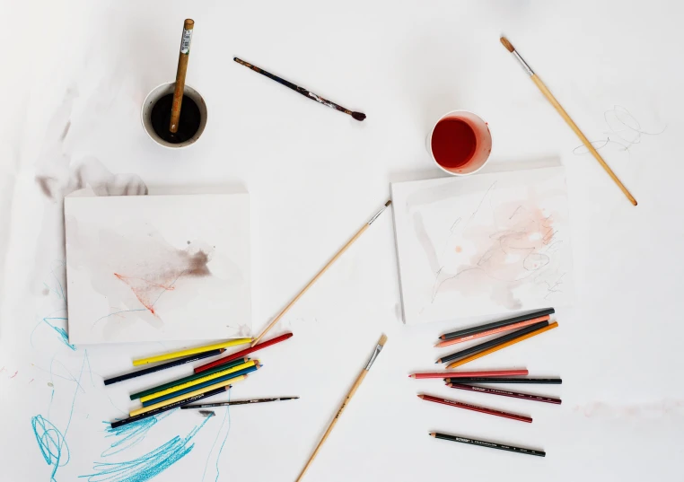 the supplies are shown with paint and brushes