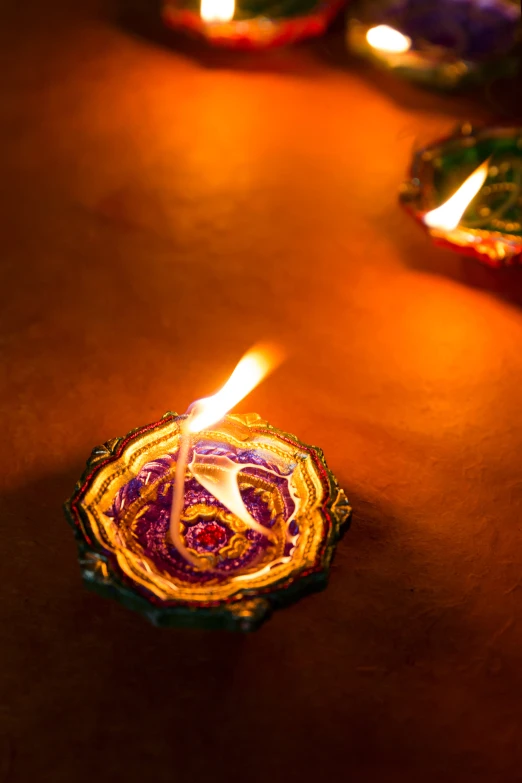 a couple of candles are sitting on a table