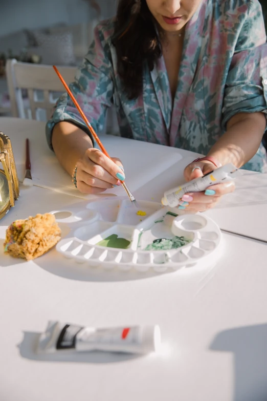 a person with a pen and some food