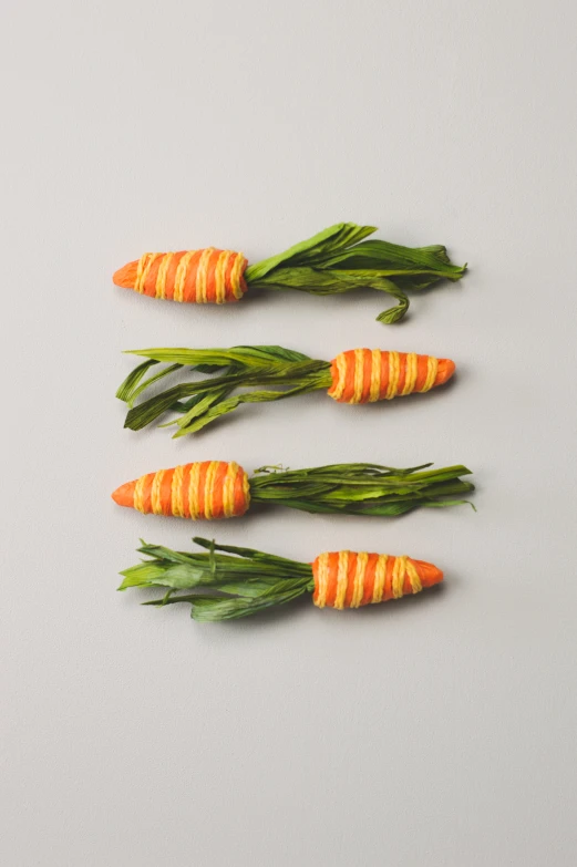 four veggies laid out in a row on the table