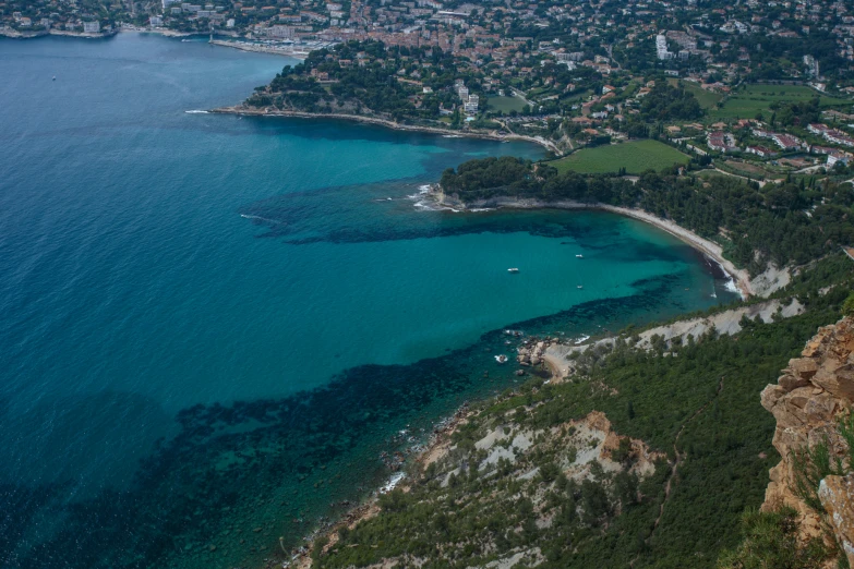 an aerial view of a small town on a shore line