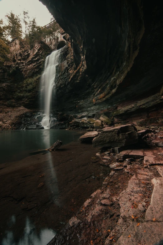 a waterfall is coming out of the water of some sort