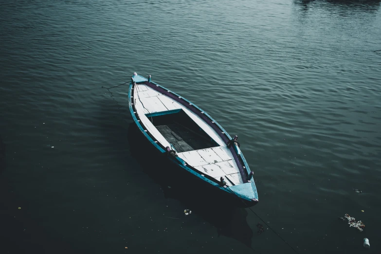 a small boat floating on top of water