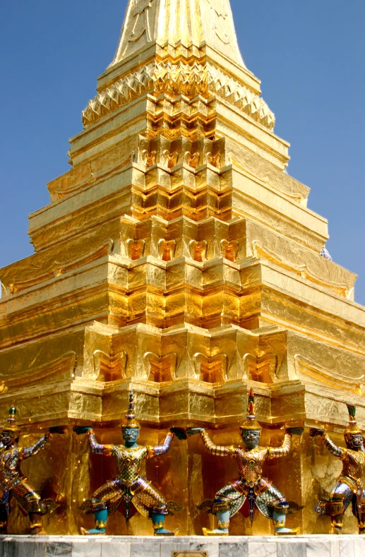 the building is gold and white with ornate decoration