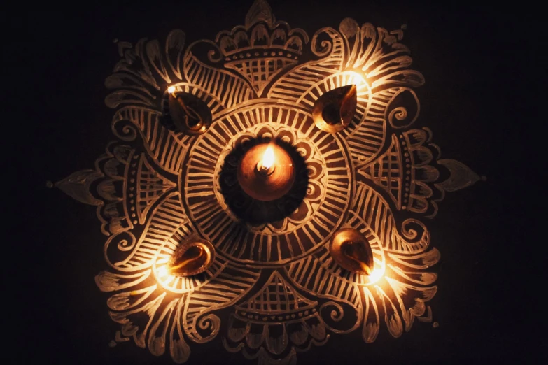 a circular decorative design with candle lights