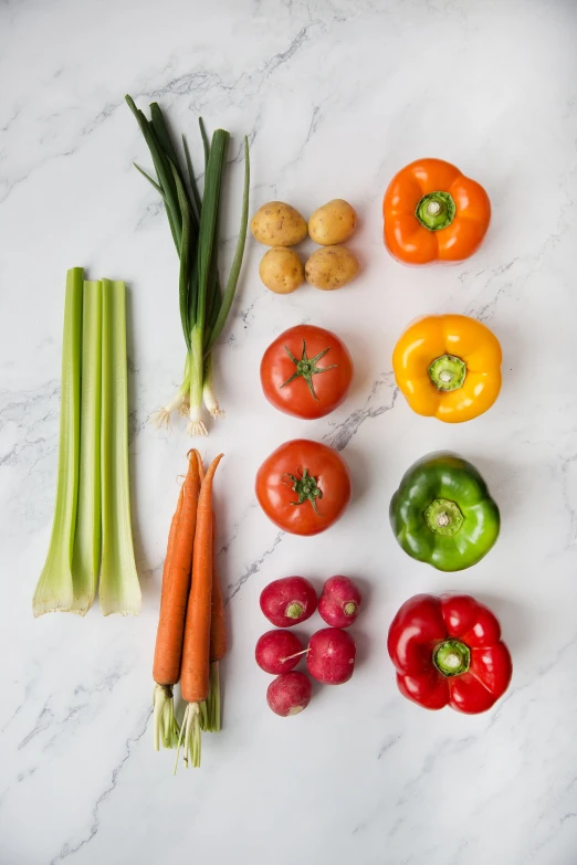 a group of vegetables with the tops of them laid out