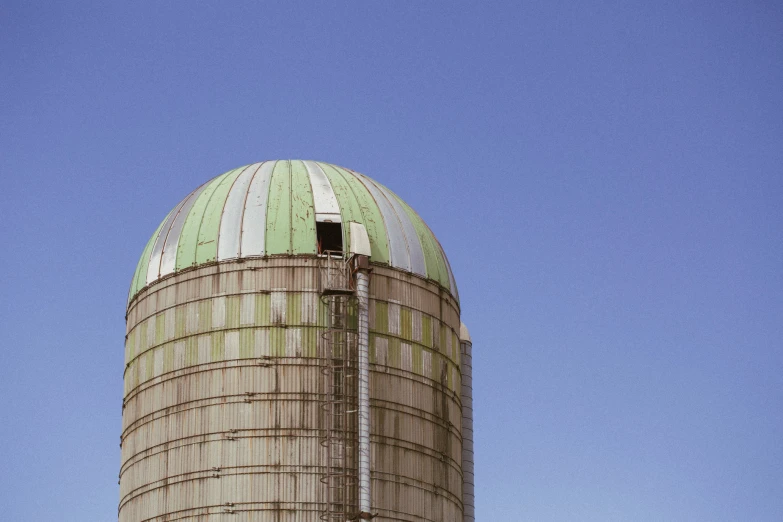 the building has two sides and is green and white