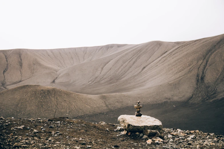 a well placed water pump on the side of a hill