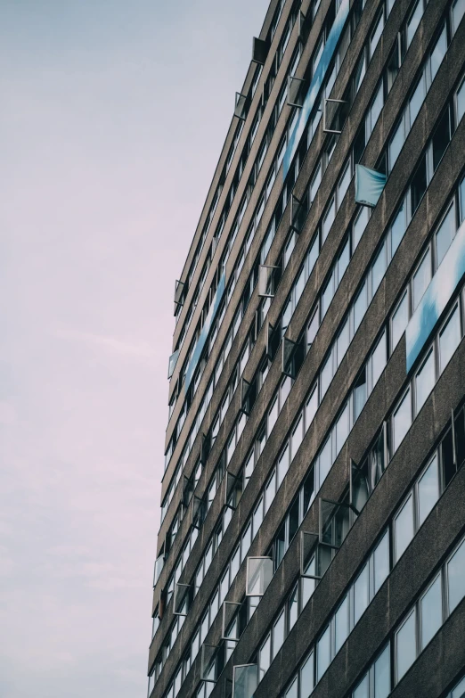 an upward view of a building with many windows