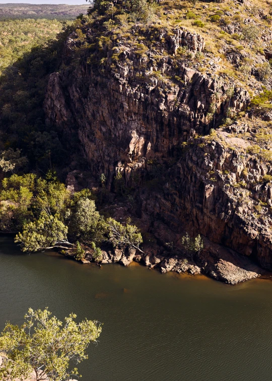 the water is moving along a large cliff