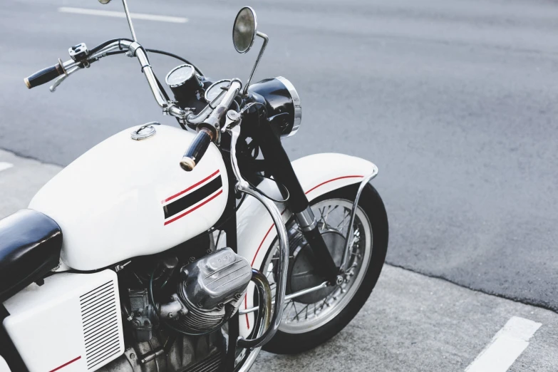 a black and white po of a motorcycle parked in the street