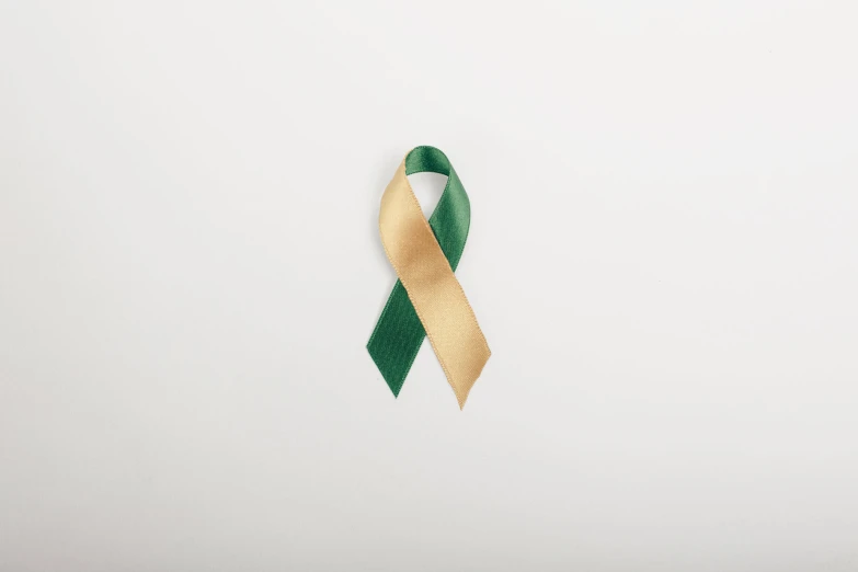 a pair of green, yellow and white ribbons attached to each other