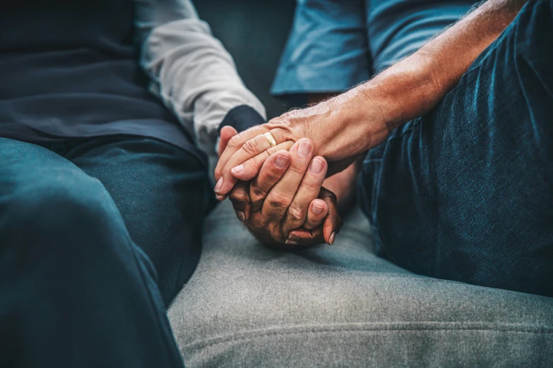 two people who are holding each other's hands