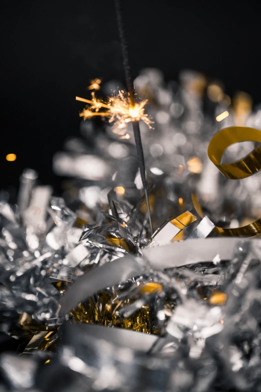 sparklers and tinsel on a black background