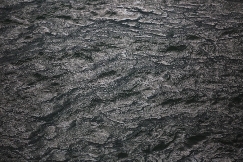 a view from the sky of a sea and rocks