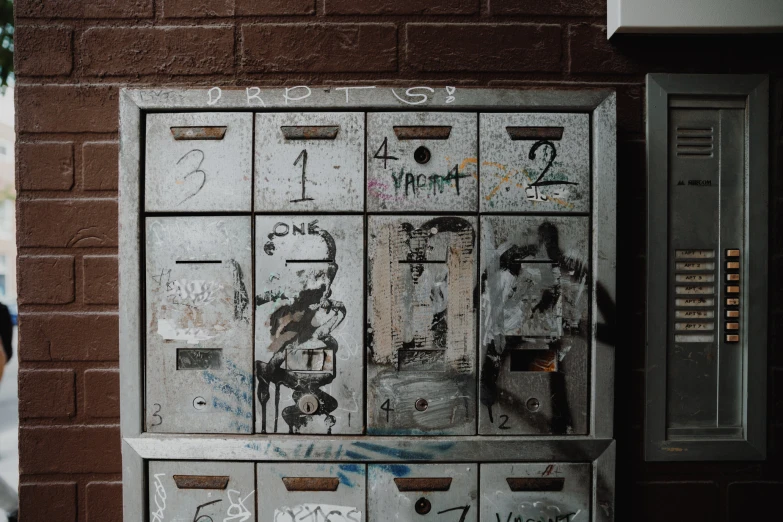 a silver box with many doors and some writing on it