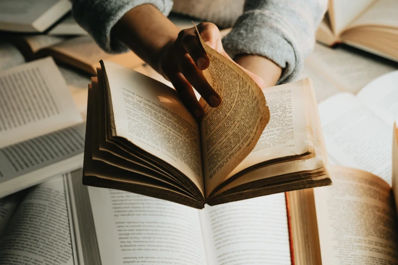 a person is opening and reading a book