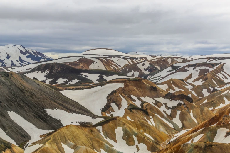 a mountain range with many mountains and brown hills