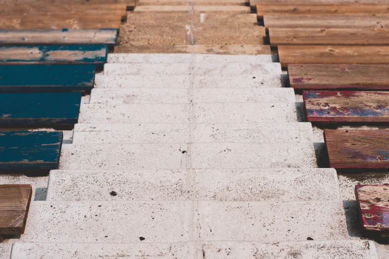 a row of wooden benches sitting next to each other