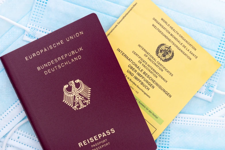a german passport and an eu passports visa card on blue background